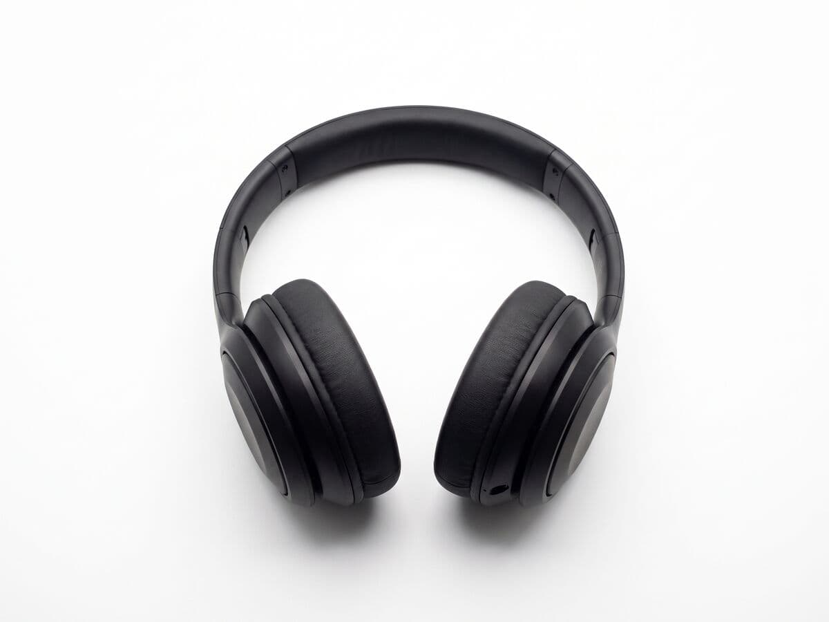 Black over-ear headphones on a pure white background, framed for an Amazon main image