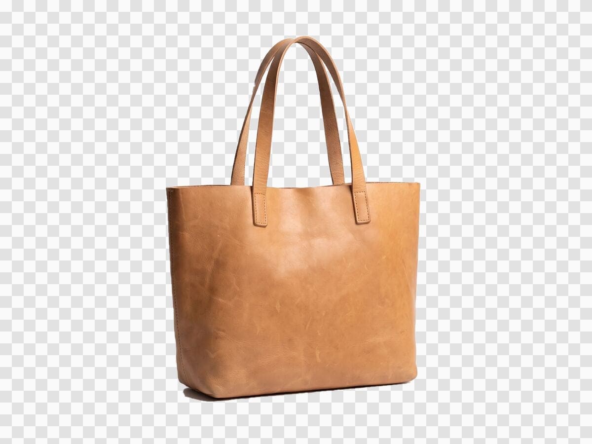 The same tan leather tote cut out on a transparent checkerboard background