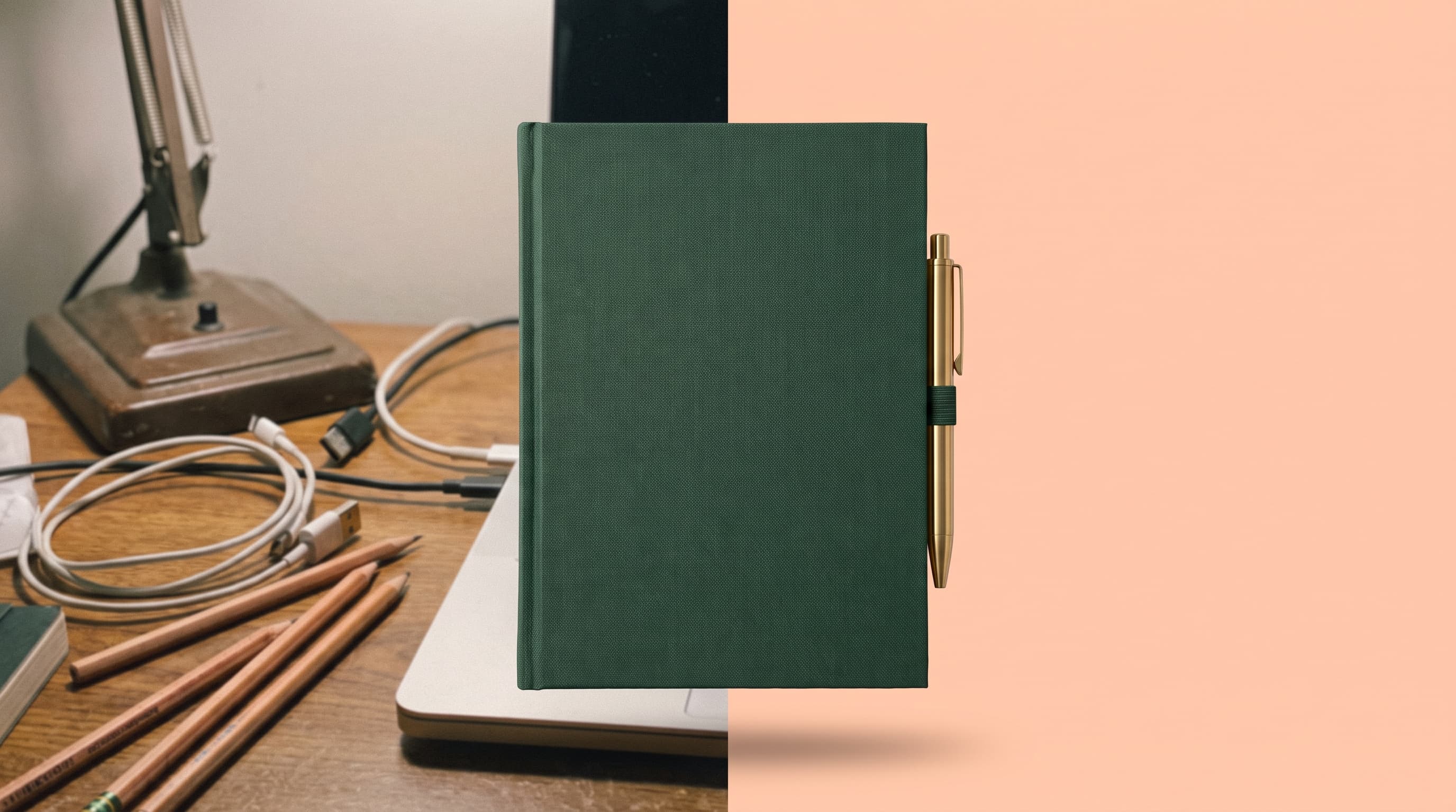 A dark green hardcover notebook with a brass pen on a cluttered desk on the left, cut out onto a flat soft pastel peach background on the right
